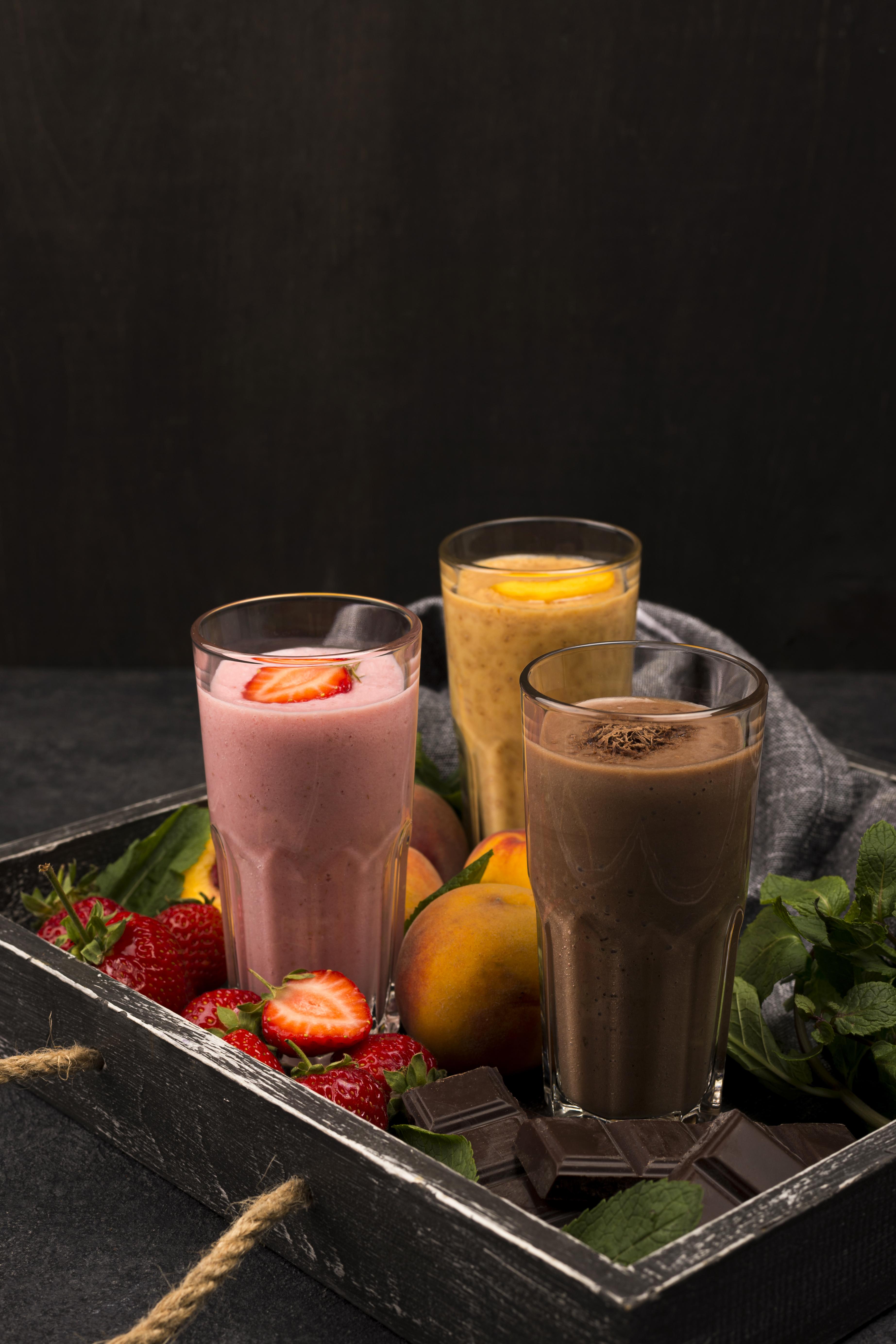 Two people talking at table in plant-filled café
